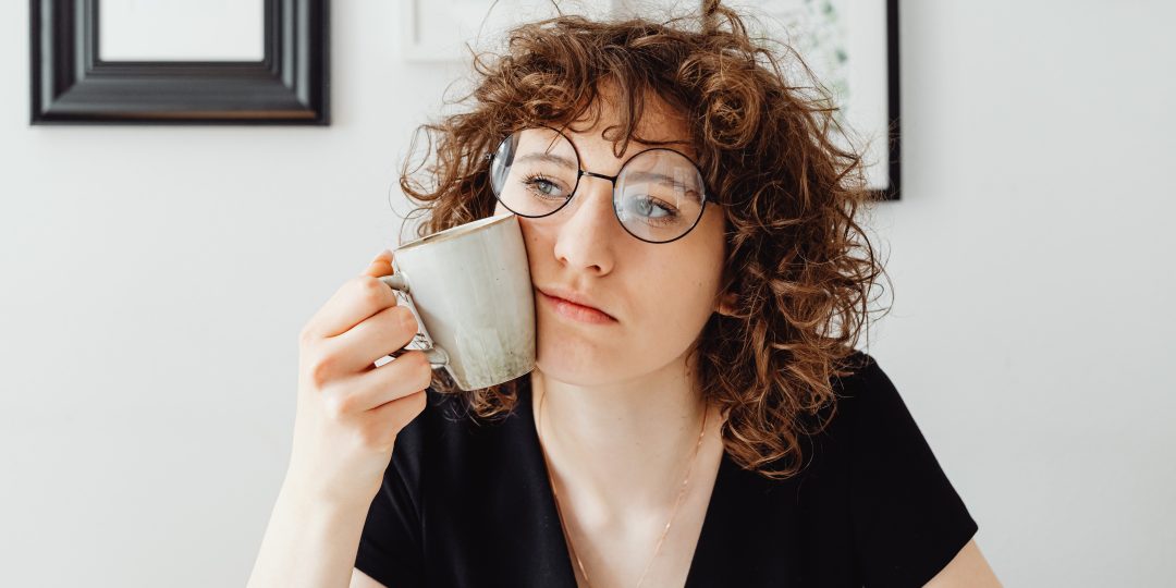 Woman thinking about coffee